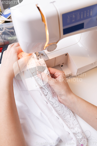 Image of Photos of sewing-machine, hand woman