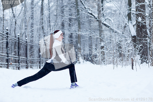 Image of Sports woman on stretching exercises