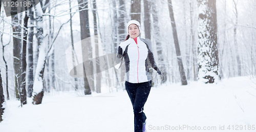 Image of Running young brunette in sportswear