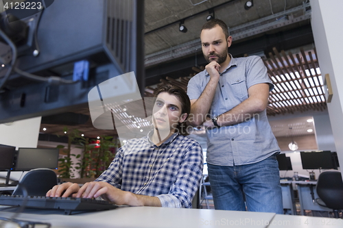 Image of startup business people group working as team to find solution