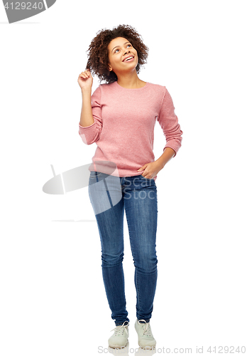 Image of happy african american young woman over white