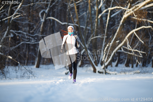 Image of Sportswoman on jogging in winter