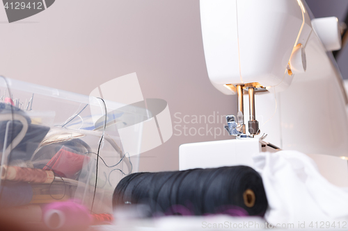 Image of Sewing-machine close up with accessories