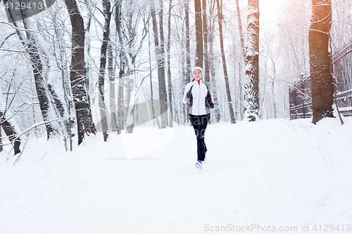 Image of Beautiful brunette on morning jog