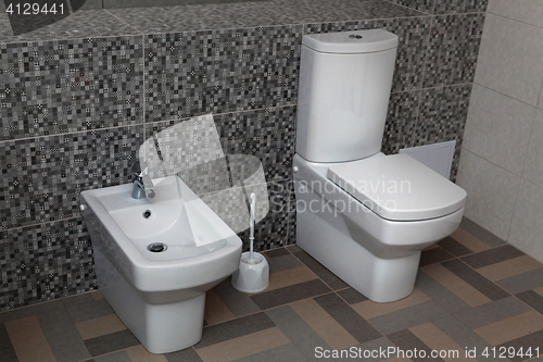 Image of white toilet and bidet 