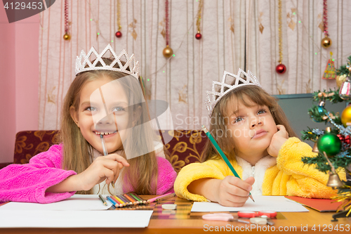 Image of Two girls make a wish for the new year