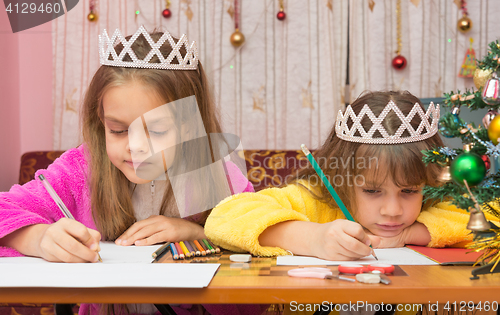 Image of Sad Sisters write a letter to Santa Claus