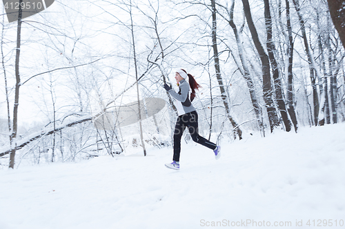Image of Young woman on morning jog