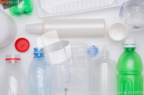 Image of Plastic bottles on empty table