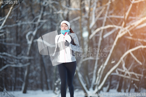 Image of Young athlete engaged in running