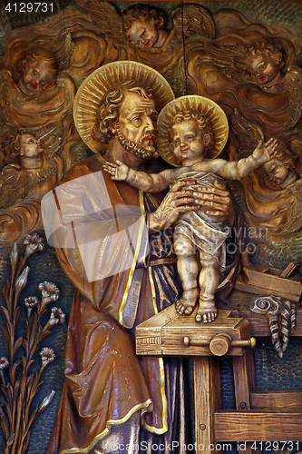 Image of Saint Joseph holding baby Jesus