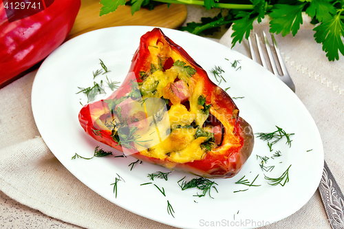 Image of Pepper stuffed with sausage and cheese on granite table