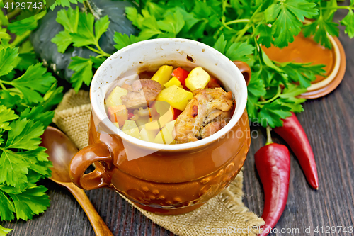 Image of Roast meat and potatoes in portion pot on board