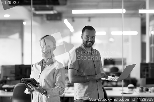 Image of business couple at office