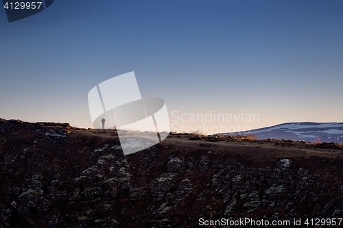 Image of Landscape with mountains and small man