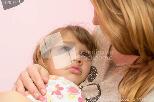 Image of Mom comforting five-year daughter