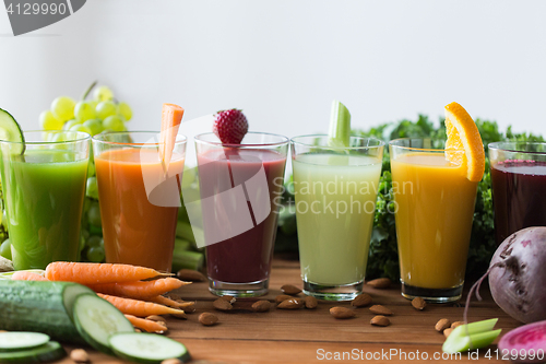 Image of glasses with different fruit or vegetable juices