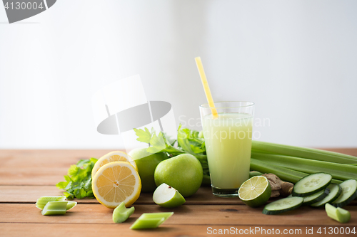 Image of glass of green juice with fruits and vegetables
