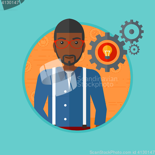 Image of Man with business idea bulb in gear.
