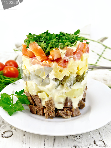 Image of Salad with beef and tomato on board