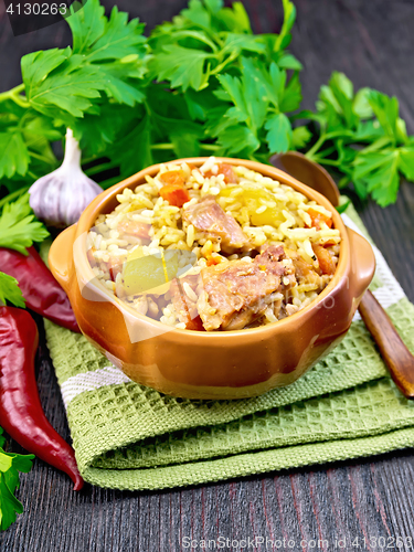 Image of Rice with chicken and zucchini in bowl on napkin