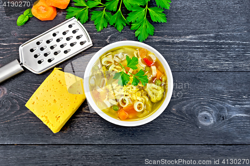 Image of Soup Minestrone in bowl on black board top