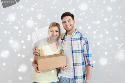 Image of happy smiling couple with parcel box