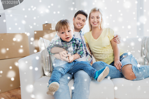 Image of happy family with boxes moving to new home