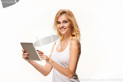 Image of Portrait of beautiful smiling girl with modern laptop