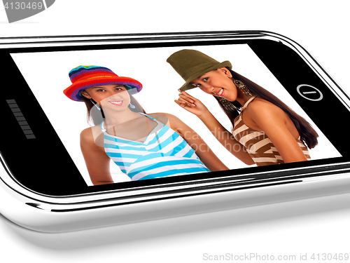 Image of Two Teenage Friends In Hats Picture On Smartphone