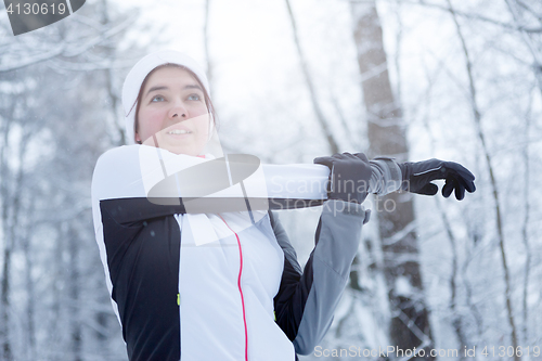 Image of Sport brunette on stretching exercises