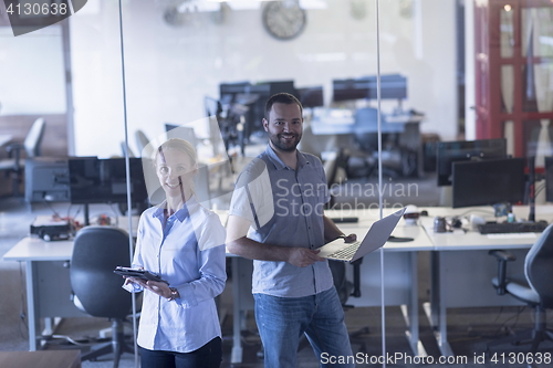 Image of business couple at office