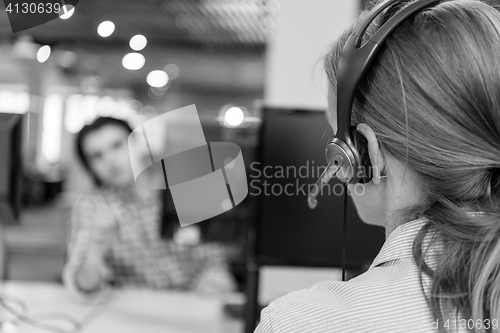 Image of female support phone operator