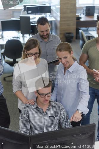 Image of startup business people group working as team to find solution