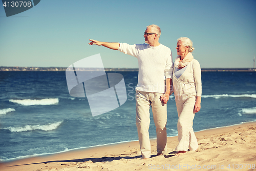 Image of happy senior couple on summer beach