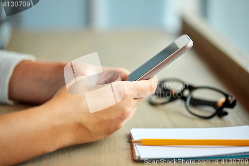 Image of close up of woman texting on smartphone