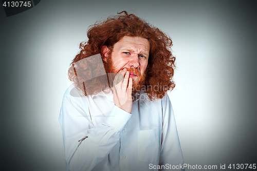 Image of Young man is having toothache.