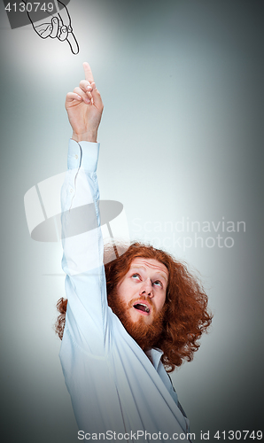 Image of Portrait of young man with shocked facial expression