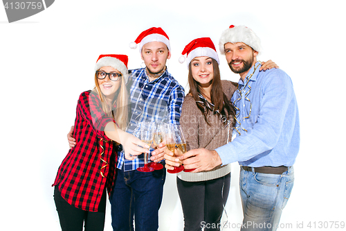 Image of Many young women and men drinking at christmas party