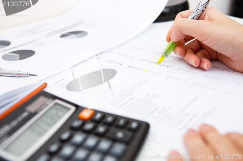 Image of Desk woman with accounting records