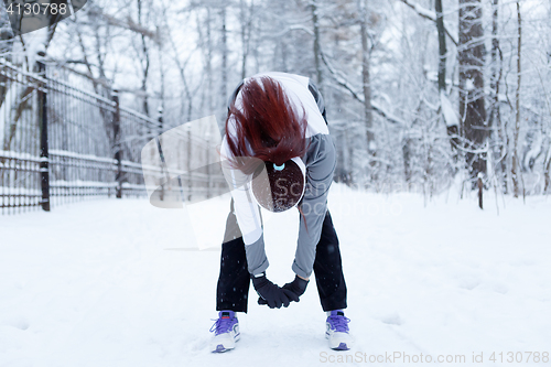 Image of Winter woman in stretching exercises