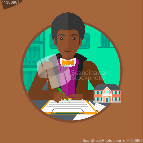 Image of Real estate agent signing contract.