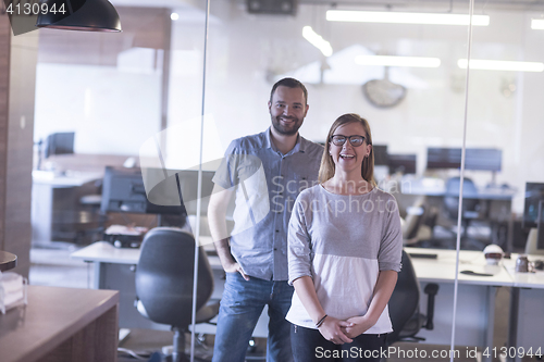 Image of business couple at office