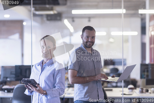 Image of business couple at office