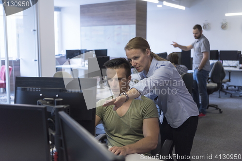 Image of business couple at office