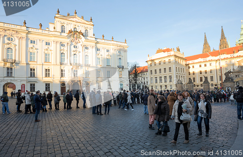 Image of Tourists queue in front of the Prague Castle