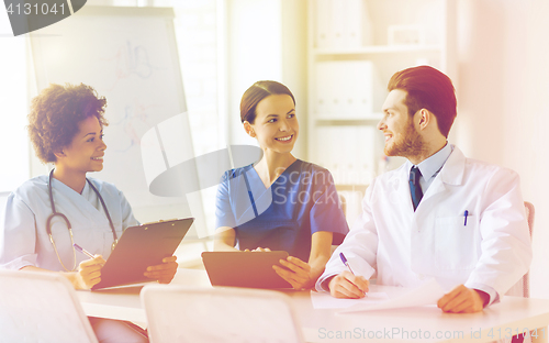 Image of group of happy doctors meeting at hospital office