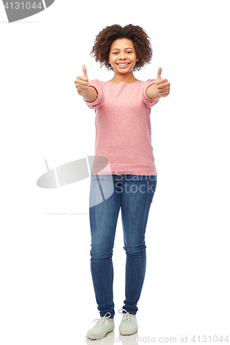 Image of happy african american woman showing thumbs up