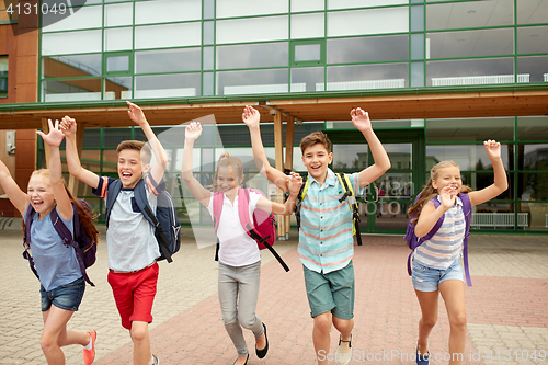 Image of group of happy elementary school students running