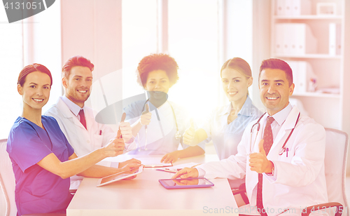 Image of group of happy doctors meeting at hospital office
